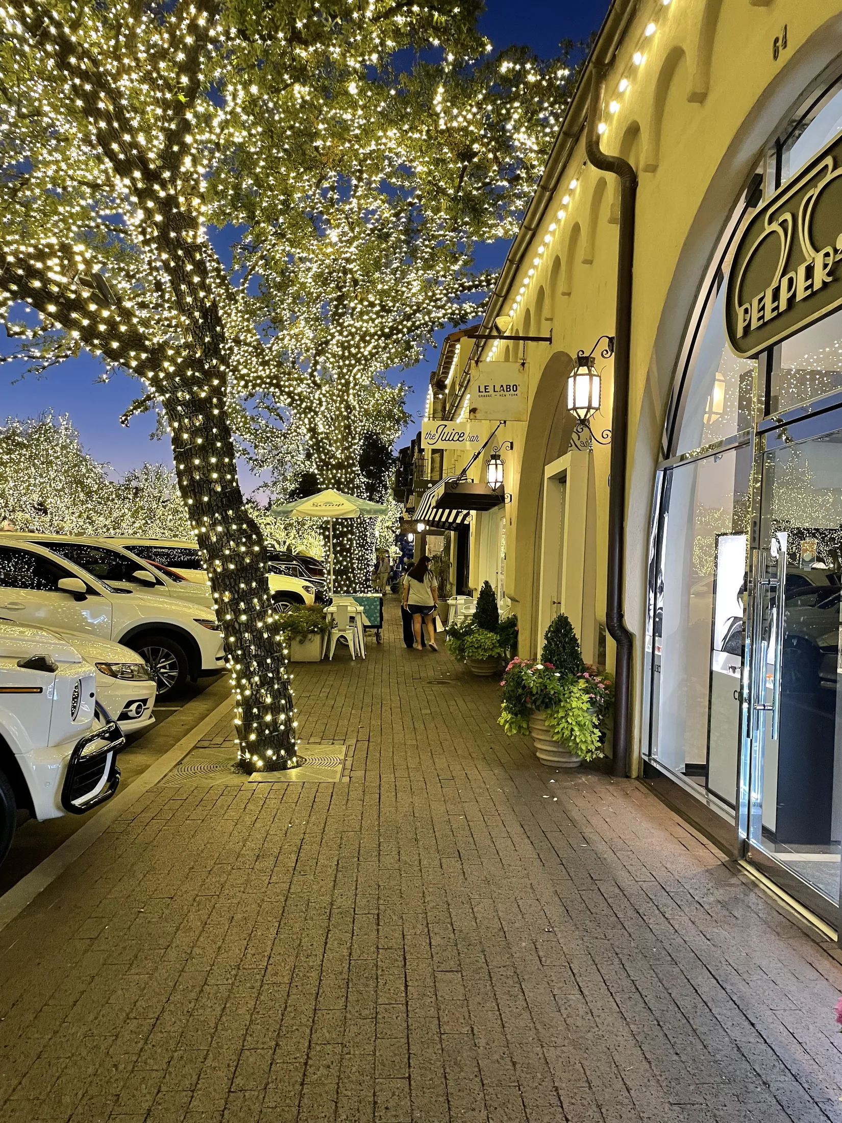 Highland Park Village illuminated at night
