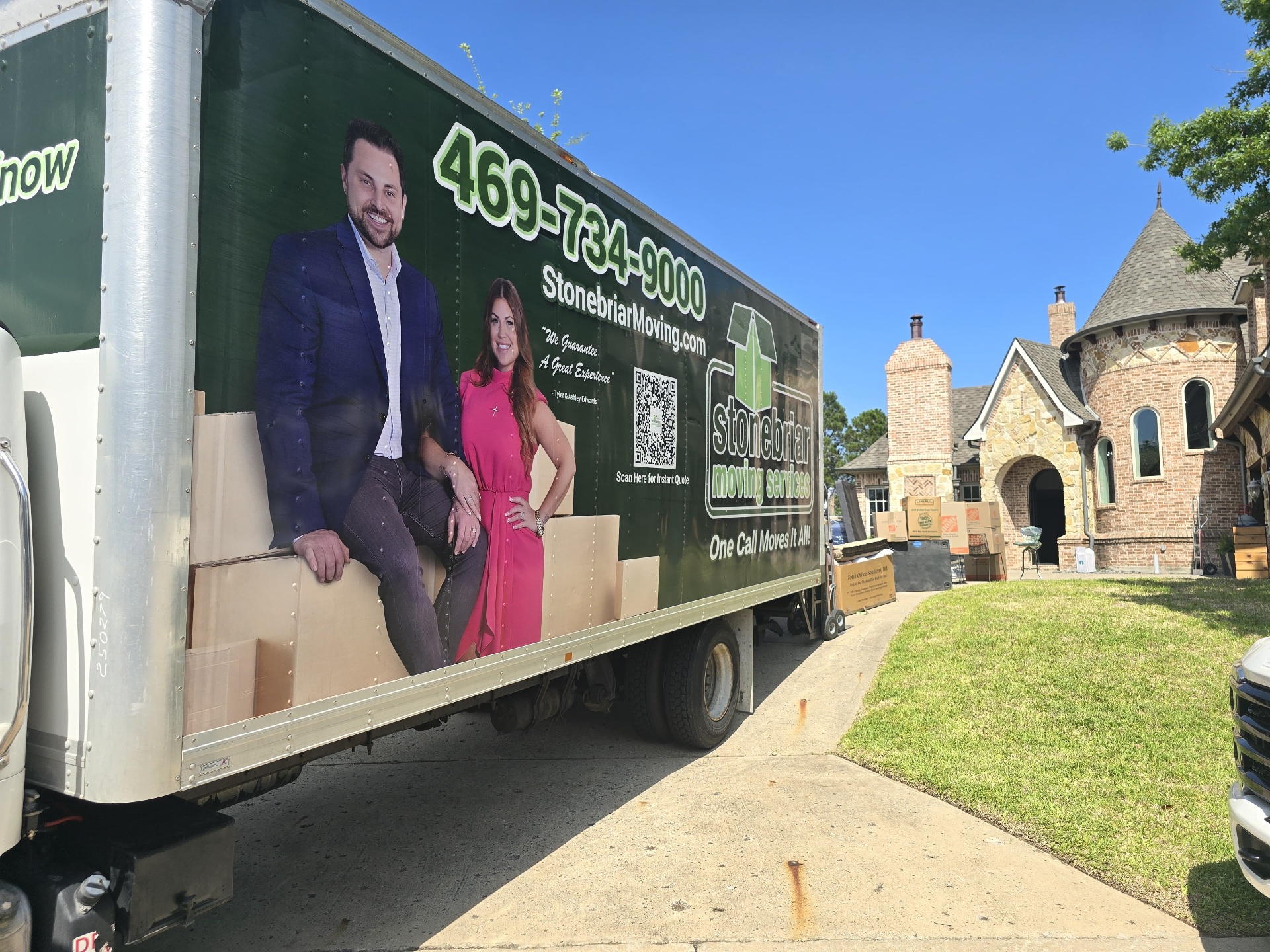 Stonebriar moving truck parked outside a luxury Frisco home